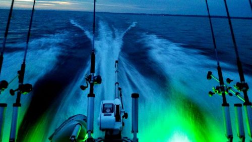 Looking behind from a fishing boat showing green LEDs