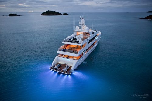 A big boat travelling along the sea using the blue led light
