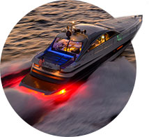 A circle image of a red light being used by a speedboat
