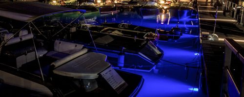 Boat in the docks with blue led lights