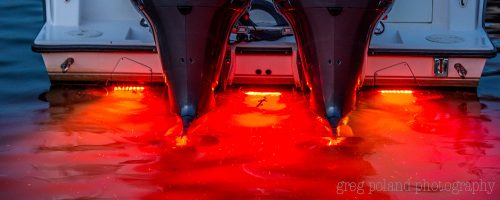 A Close up photo of a boat using red led lights