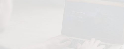 A light photo someone typing on a laptop