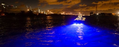 A dark blue light being used the boat