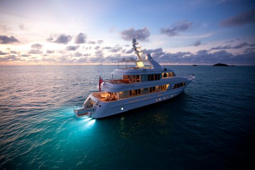 A boat travelling along the sea using the light blue led light