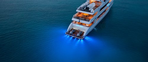 Superyacht in calm waters showing blue LED