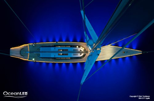 Superyacht shot from mast showing LEDs on the water
