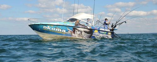Finders keepers fishing team on a boat fishing