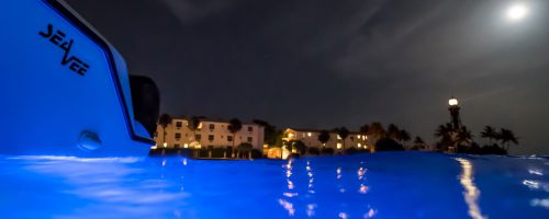 A sailsmen boat using a blue LED light