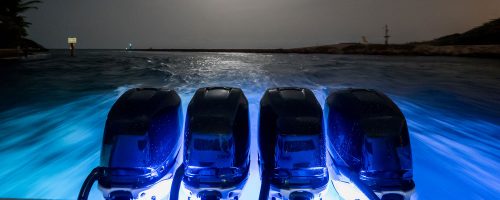 A back view of a speed boat using a blue LED Light