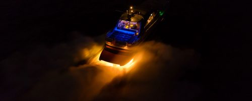 A boat traveling in the dark