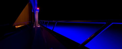 Superyacht LEDs illuminating water at night